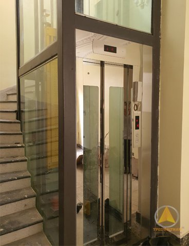 Cửa tầng thang máy kính inox + kính + cửa lùa