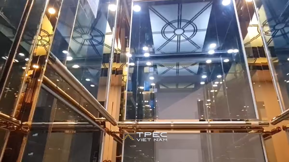 Cabin thang máy kính vàng