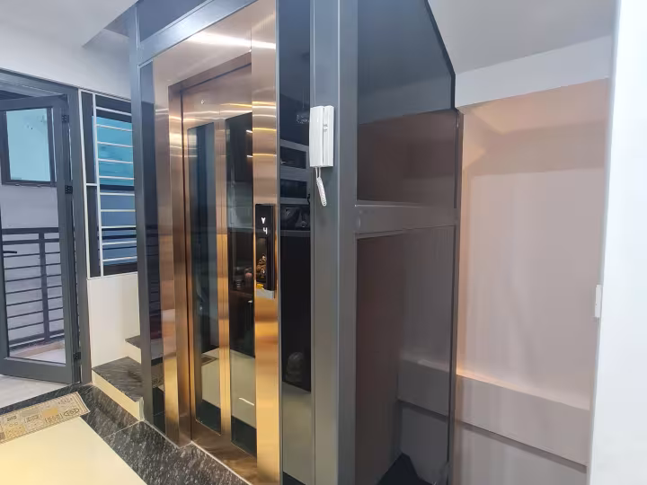 Thang máy kính 350kg Inox đồng